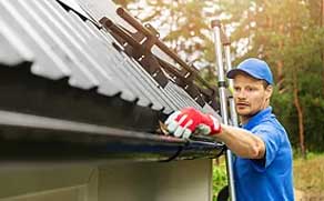 A man providing gutter cleaning services in Vancouver
